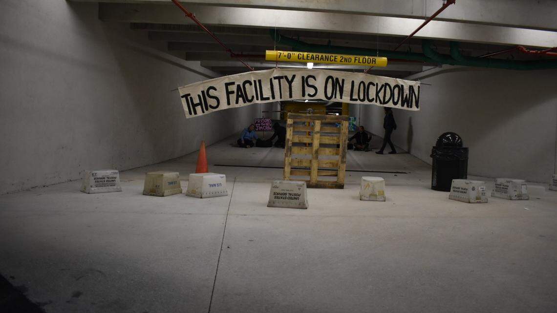 Protesters blocked the entrance to GEO Group’s Boca Raton headquarters in December 2019.