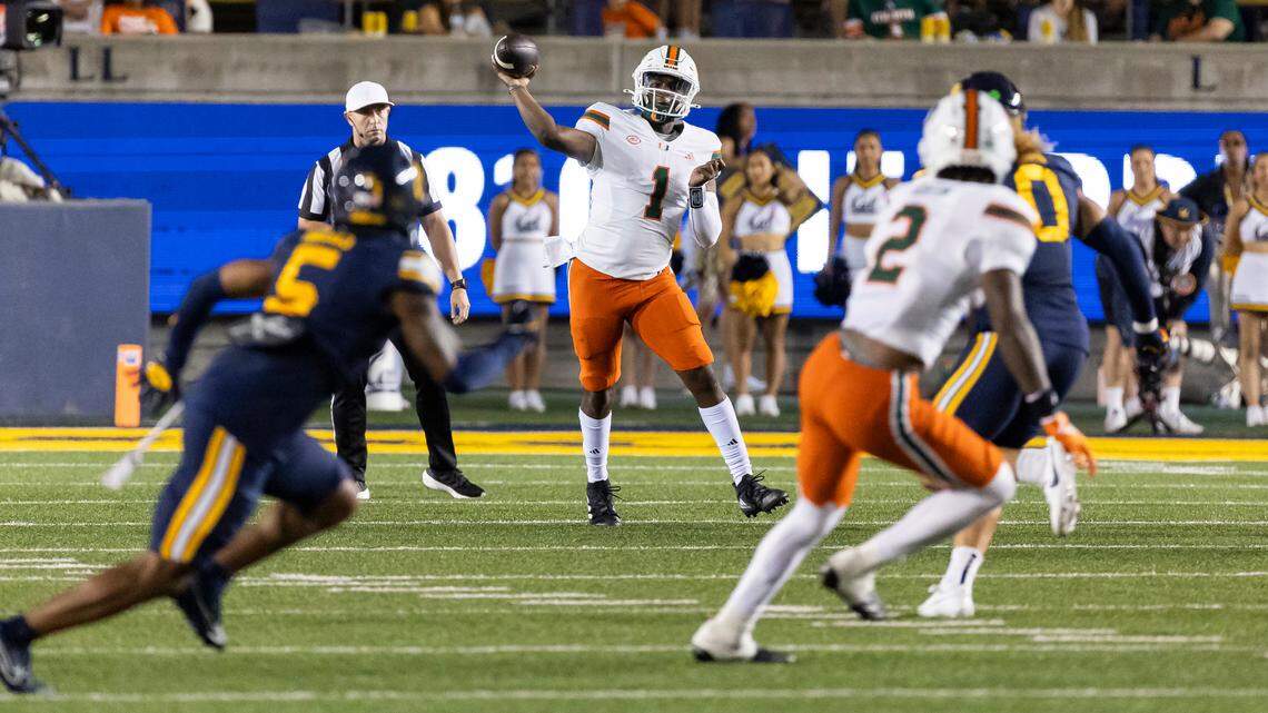 Miami Hurricanes quarterback Cam Ward (1) looks to pass the ball to wide receiver Isaiah Horton (2) in the second half of their NCAA college football game against the California Golden Bears at the California Memorial Stadium on Saturday, Oct. 5, 2024, in Berkeley, Calif.