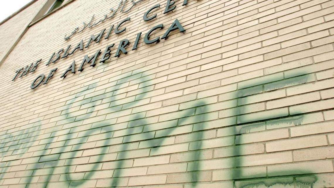 In 2007, anti-Muslim graffiti defaces a mosque at the Islamic Center of America in Dearborn, Michigan.