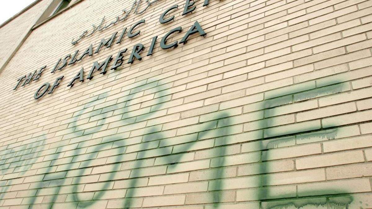 In 2007, anti-Muslim graffiti defaces a mosque at the Islamic Center of America in Dearborn, Michigan.