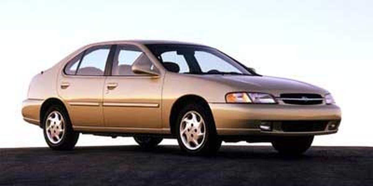 A late 90s, early 00s champagne colored Nissan Altima