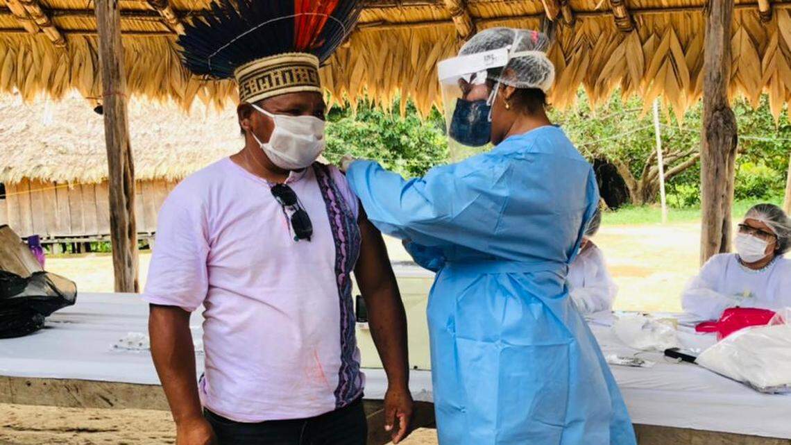 A man of the Tunayana tribe gets the COVID-19 vaccine at his village in the Amazon state of Pará.