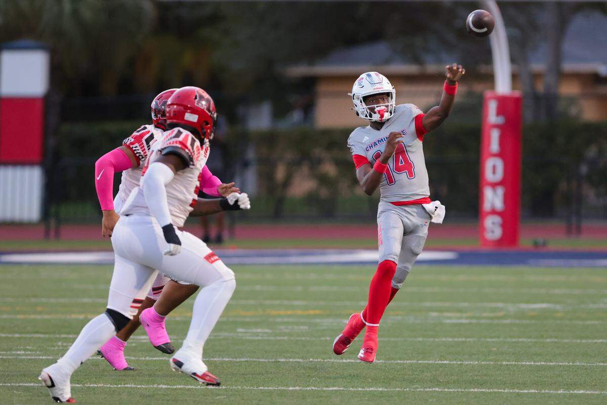 Chaminade-Madonna Lions quarterback Malik Leonard (14) passes the football against the Monarch Knights during the first quarter of a high school football game at Chaminade-Madonna College Preparatory school in Hollywood, Florida, Friday, October 3, 2025.