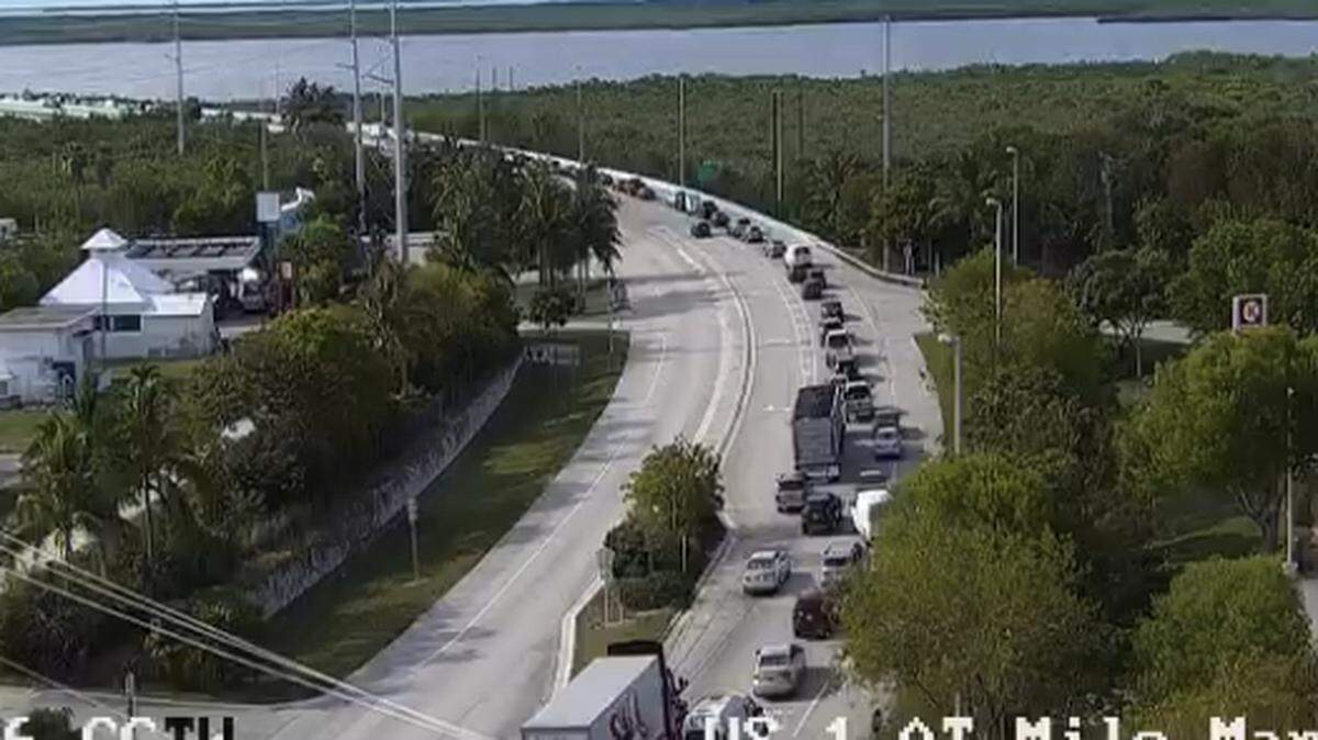 Lines of cars and trucks slowly approach the southern end of the Jewfish Creek Bridge leaving Key Largo Wednesday, April 26, 2023.