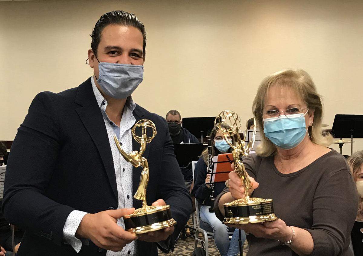 Miami Dade College Orchestra’s Albert Bade and South Florida Youth Symphony’s Marjorie Hahn proudly display Emmys. Their two organizations won the awards for their virtual concert that also featured students from Spain and Panama.