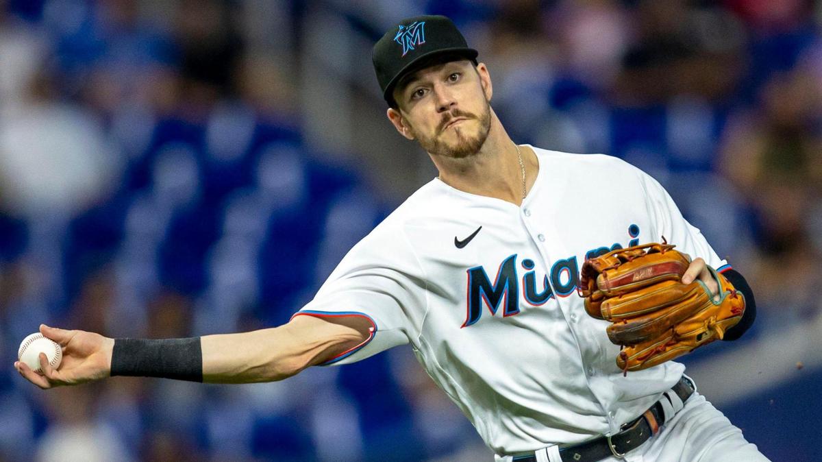 Miami Marlins third baseman Brian Anderson (15) throws the ball to first baseman Jesus Aguilar (99) during the first inning of an MLB game against the Seattle Mariners at loanDepot park in the Little Havana neighborhood of Miami, Florida, on Saturday, April 30, 2022.