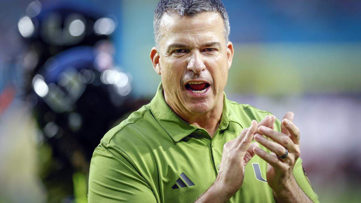 Miami Hurricanes head coach Mario Cristobal on the field during the NCAA football game against the Stanford Cardinal at Hard Rock Stadium in Miami Gardens, Florida, on Saturday, October 25, 2025.