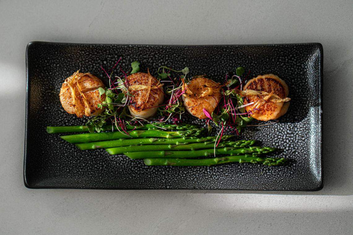 Seared scallops are just one of the menu items at Botanico Gin & Cookhouse.