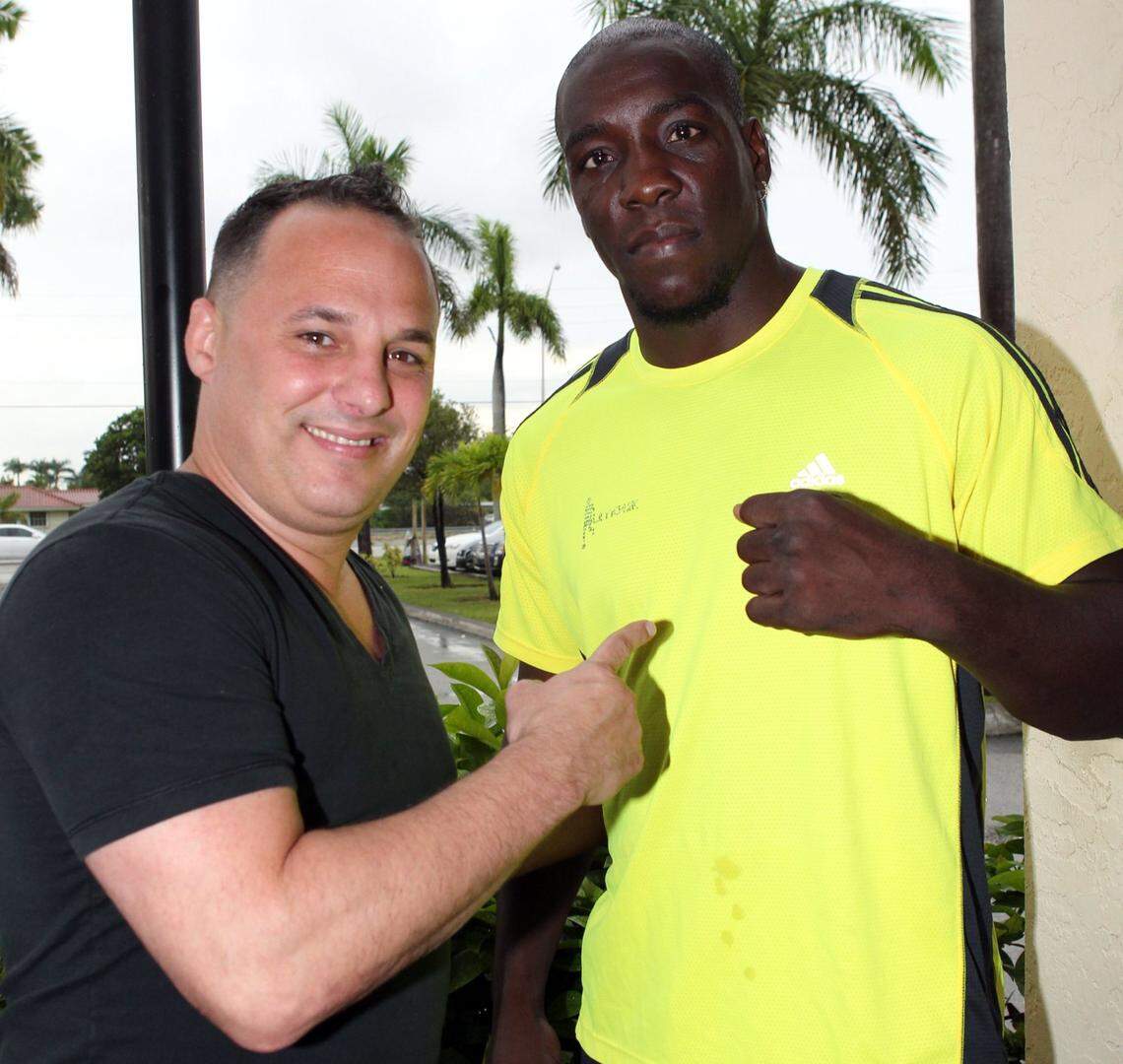 President of Caribe Promotions Boris Arencibia , left, and a client, former cuban boxer Yordanis Despaigne, in 2012 in Miami.
