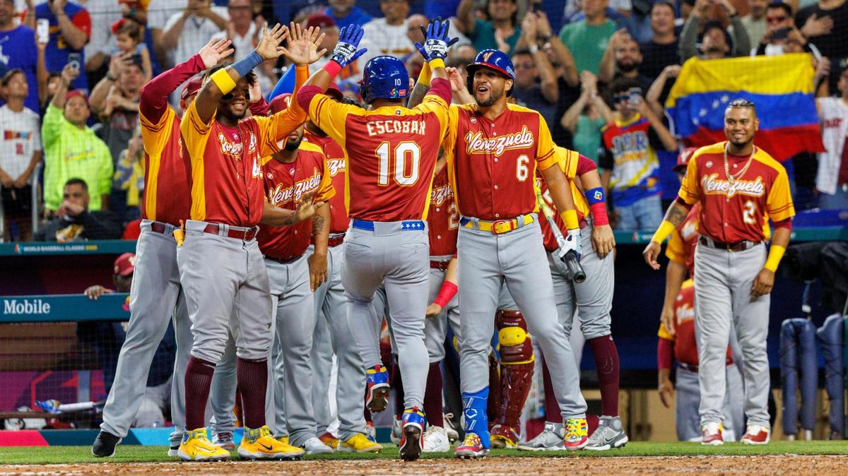 Venezuela third baseman Eduardo Escobar (10) celebrate with teammates after hitting a solo home run during the fourth inning of a Pool D game against Israel at the World Baseball Classic at loanDepot Park on Wednesday, March 15, 2023, in Miami, Fla.