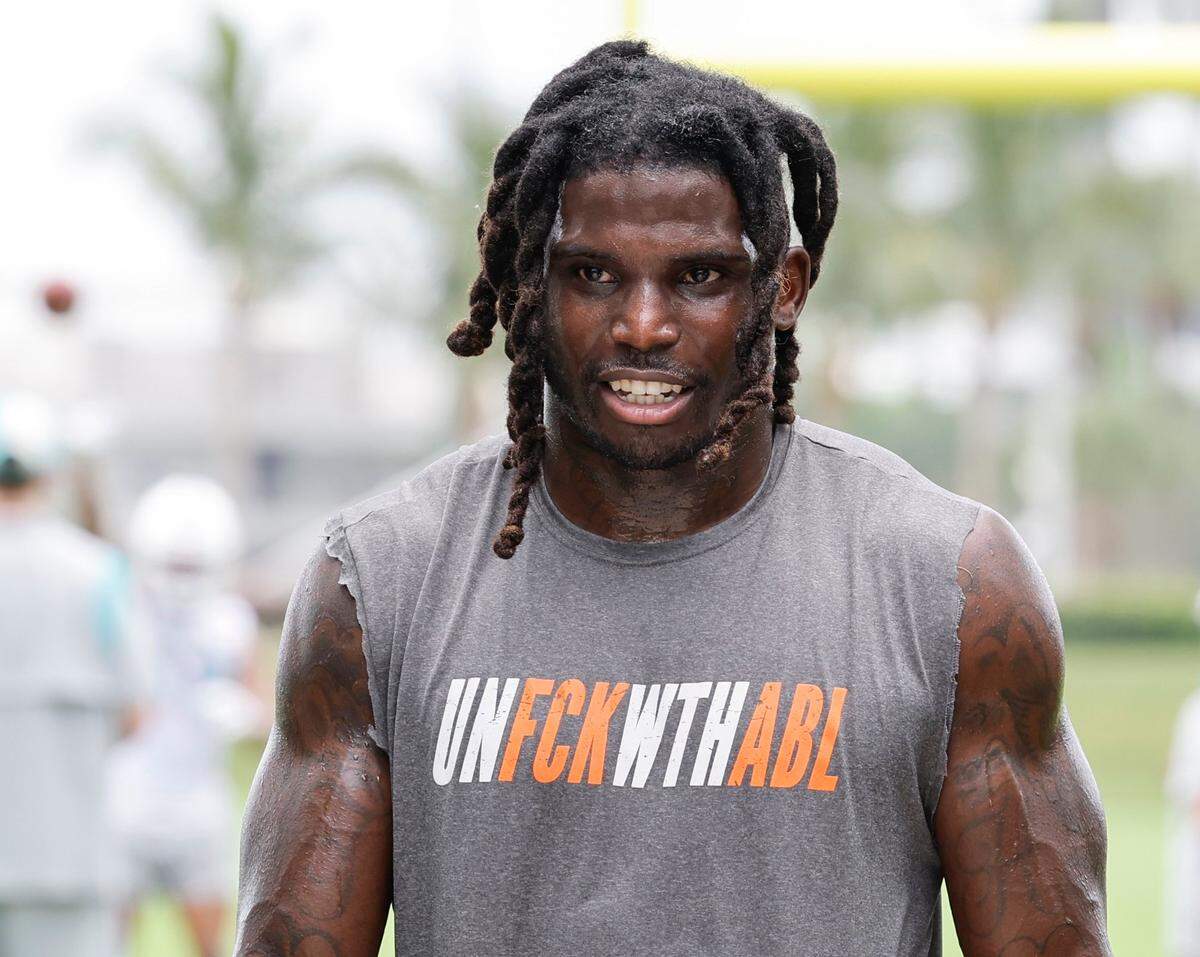 Miami Dolphins wide receiver Tyreek Hill (10) arrives for a press conference after practice at the Baptist Health Training Complex in Miami Gardens, Florida on Wednesday, July 26, 2023.