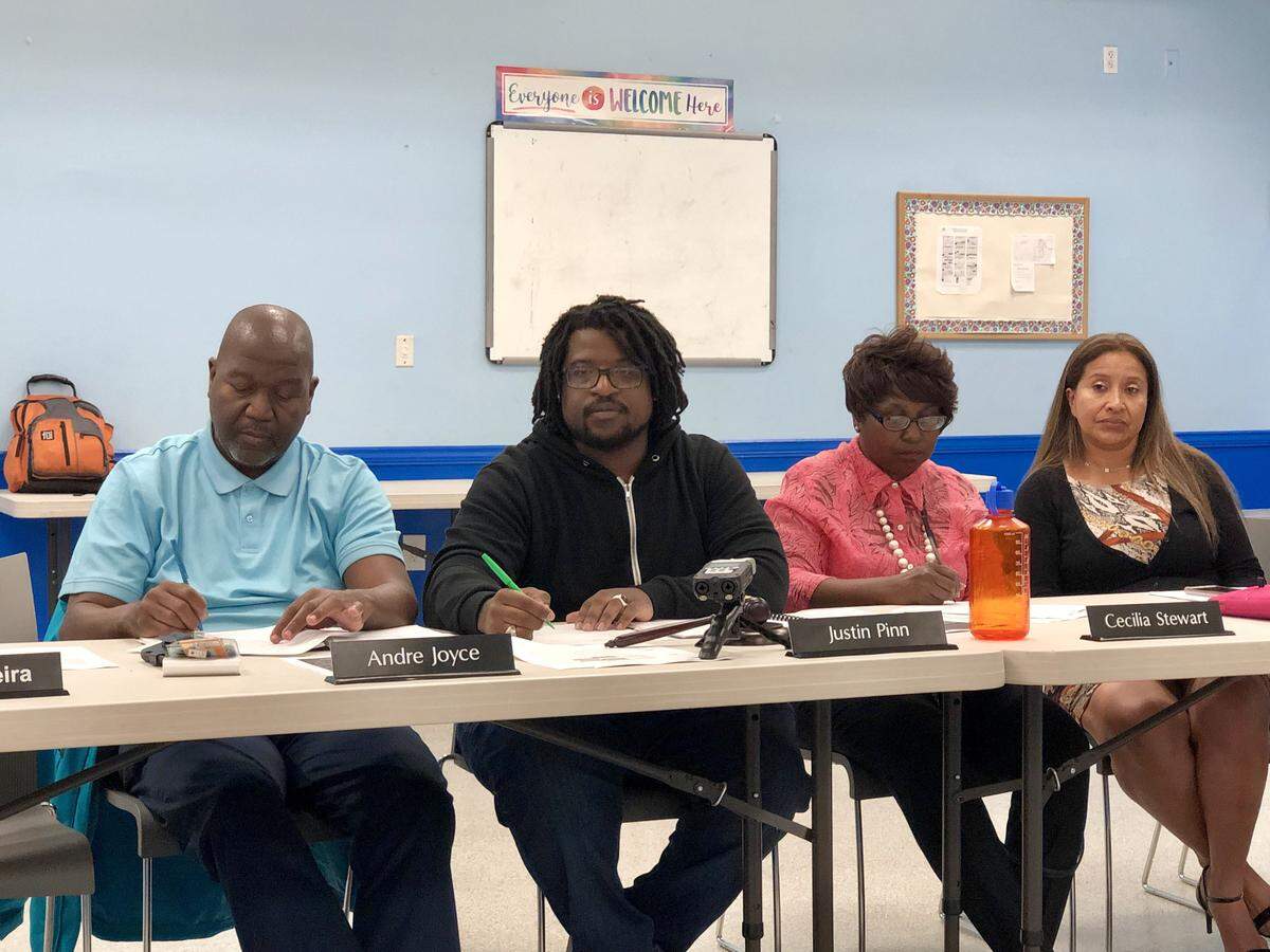 The Community Advisory Board, created to oversee police reforms under an agreement between the city of Miami and the U.S. Department of Justice, believes oversight should continue for at least another year. Board chairman Justin Pinn, center, echoed fellow board members in saying there is more work to be done.