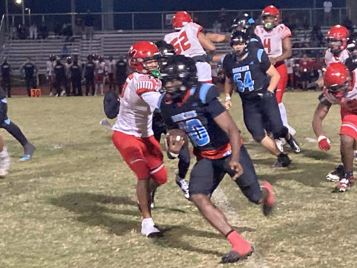 West Broward running back Daquon Adderly breaks loose around the left side as Monarch defenders pursue. Adderly finished with 176 yards on 23 carries and one touchdown in a Bobcats’ win on Friday at Cypress Bay High in Weston, Fla.