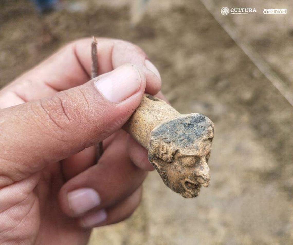 A partial flute with the face of a figure with a nose ring was discovered at the site.
