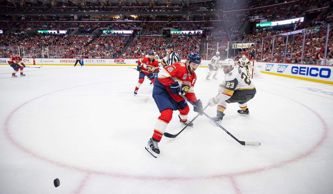 Florida Panthers left wing Matthew Tkachuk (19) and Vegas Golden Knights defenseman Alec Martinez (23) compete for the puck in the first period of Game 4 of the NHL Stanley Cup Final at the FLA Live Arena on Saturday, June 10, 2023, in Sunrise, Fla.