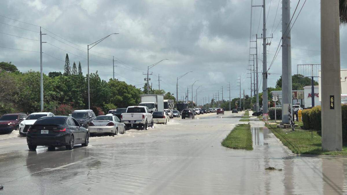 Cars drive north on U.S. 1 in the Middle Keys city of Marathon on Tuesday, May 19, 2026, as a water-main break slows traffic and causes water-pressure issues throughout the island chain.