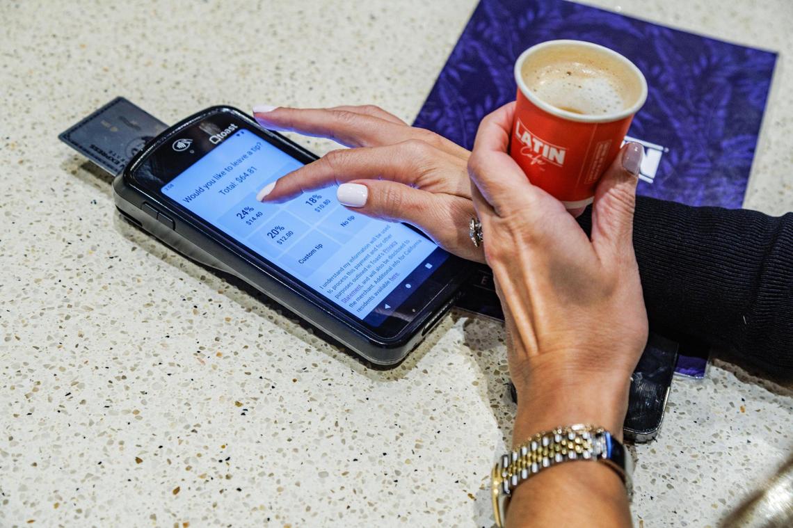 Getting ready to pay and tip at the Latin Cafe 2000.