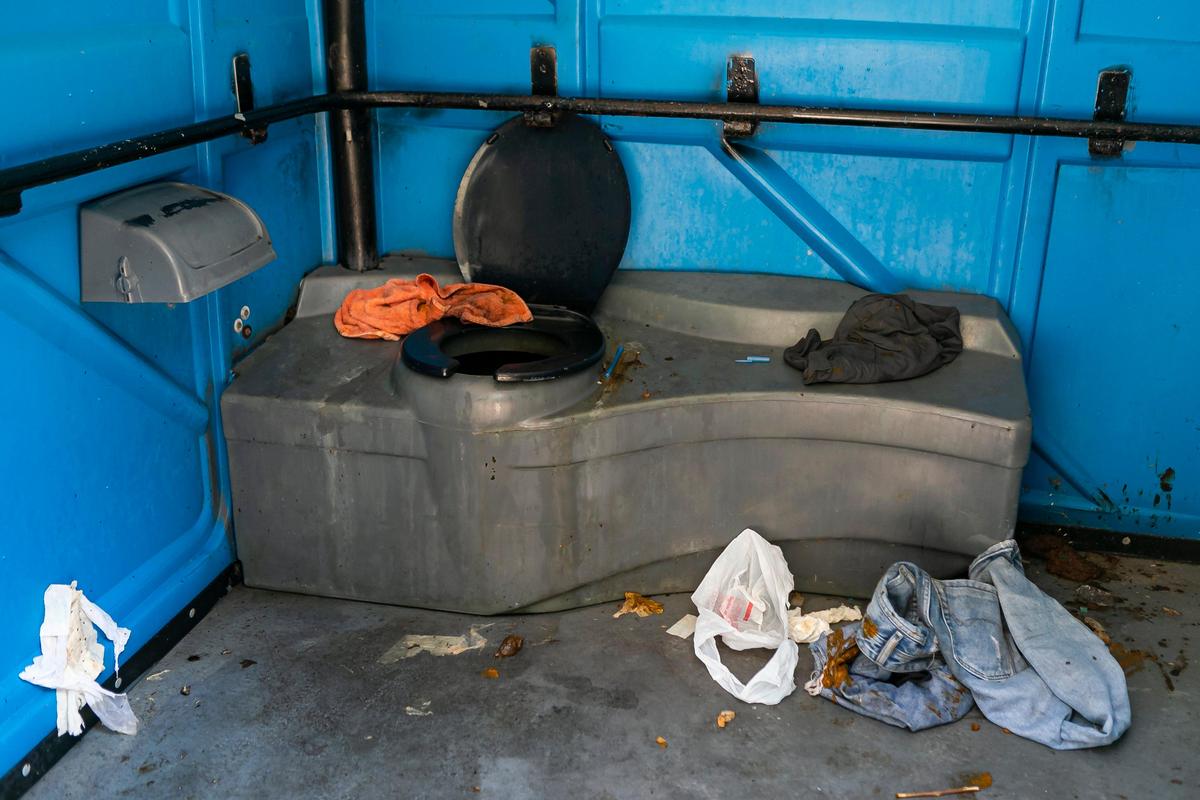 A inside view of a portable toilet near South Miami Avenue and Southwest 1st Street in downtown Miami on Tuesday, April 14, 2020.