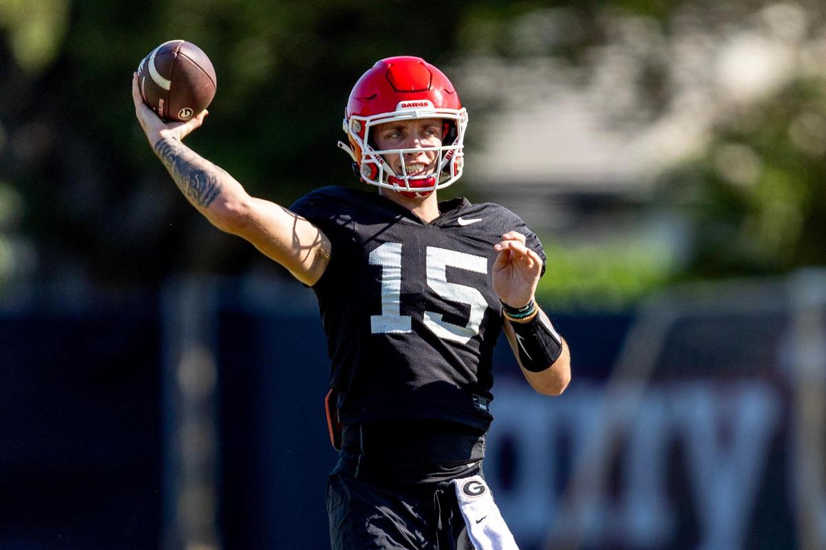 University of Georgia quarterback Carson Beck (15) throws the ball during Orange Bowl practice at Barry University in Miami Shores, Florida, on Wednesday, December 27, 2023.