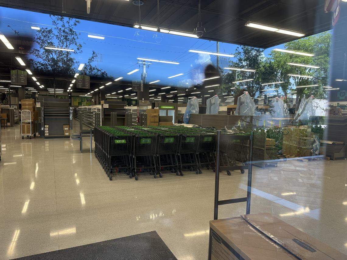 A glimpse through the window of the coming Riviera Plaza Publix in Coral Gables on Aug. 25, 2025, shows progress. Shopping carts are stocked inside and the aisles look near ready to stock. The store is opening Sept. 25, 2025, Publix says.