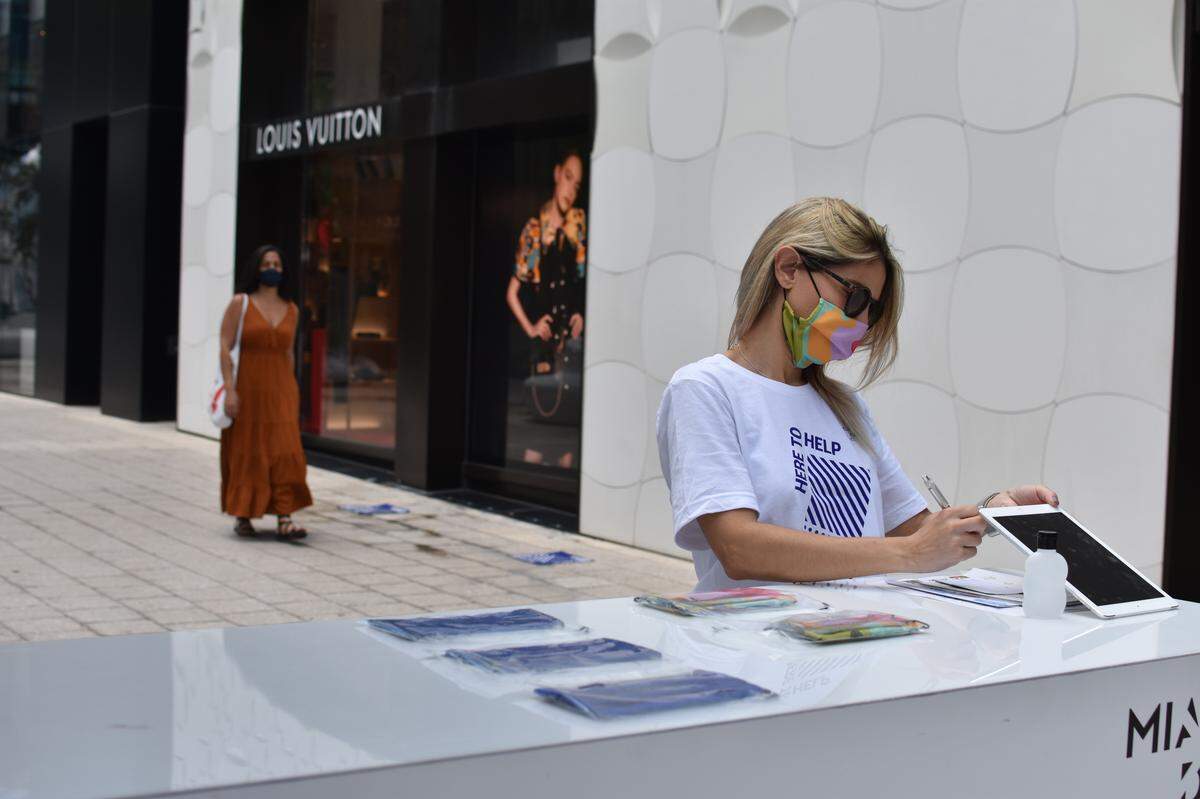 Free face masks are available at client service desks around the Miami Design District on Wednesday May 20, 2020.