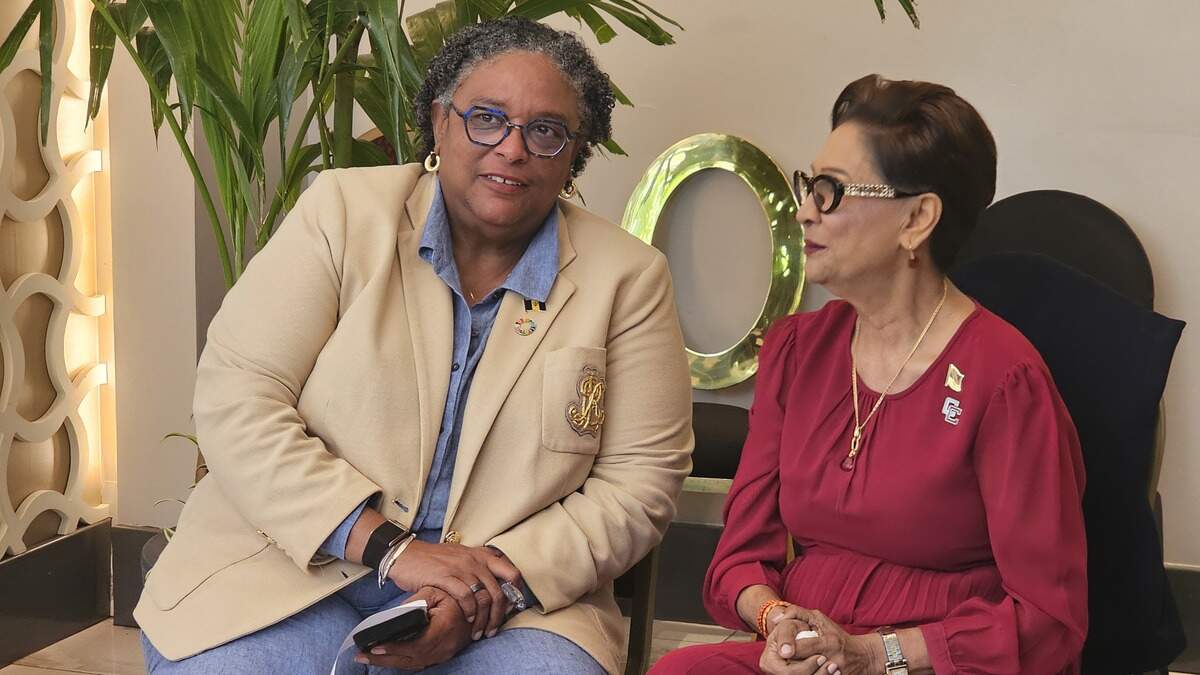 Barbados Prime Minister Mia Mottle, left, sits with Trinidad and Tobago Prime Minister Kamla Persad-Bissessar on Wednesday, July 8, 2026 during the CARICOM summit in Saint Lucia.