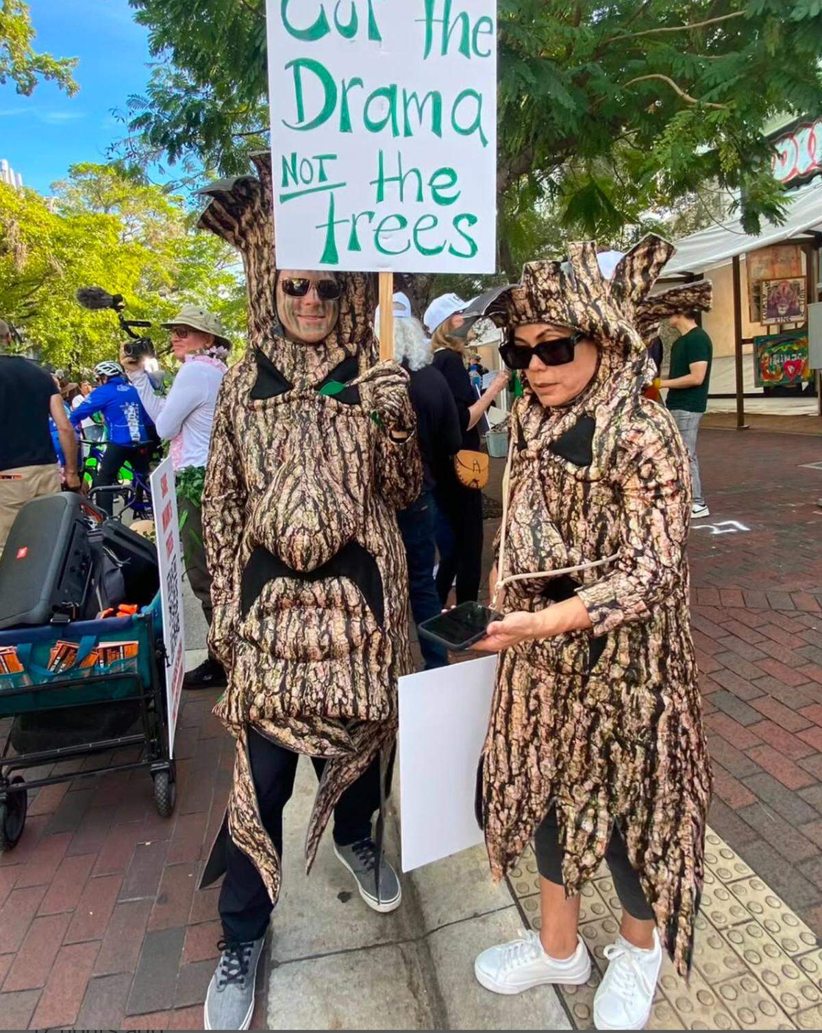 Tree lovers at the 41st annual King Mango Strut in Coconut Grove protest a potential city code change to cut down more trees for real estate development.