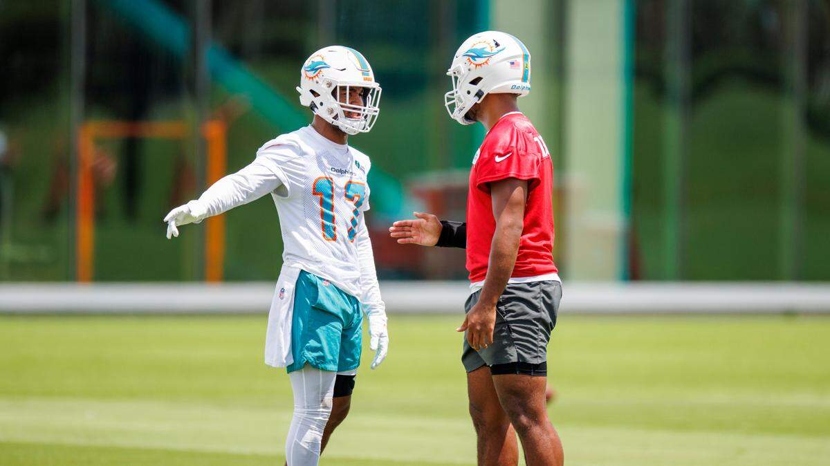 Miami Dolphins quarterback Tua Tagovailoa (1)talks with Dolphins wide receiver Jaylen Waddle (17) during NFL football training camp at Baptist Health Training Complex in Hard Rock Stadium on Thursday, September 1, 2022 in Miami Gardens, Florida.