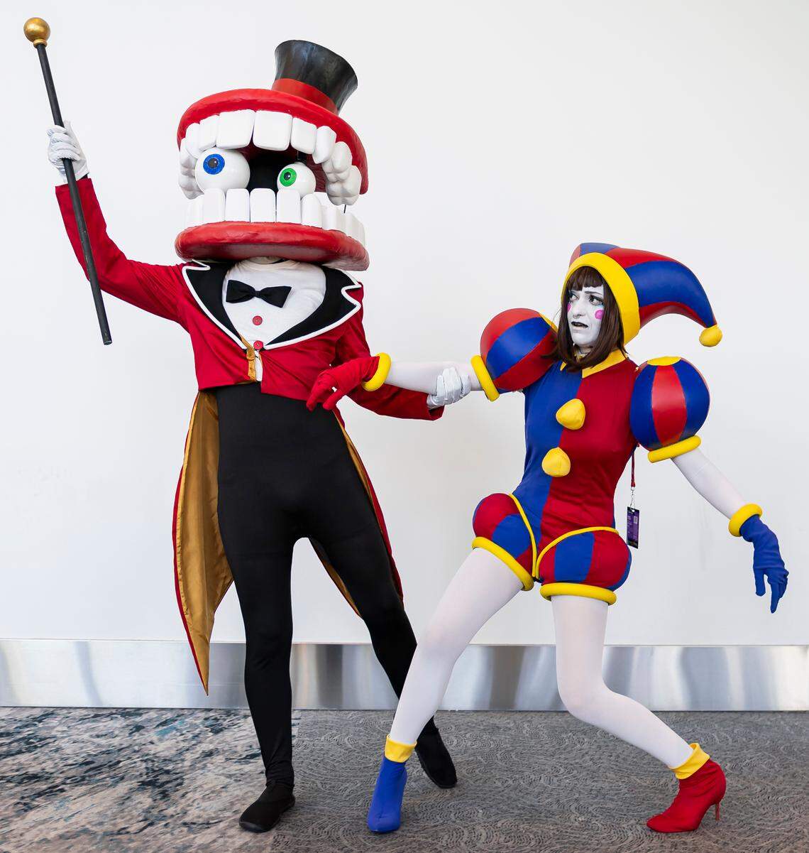Brendan Taggart, 27, as Caine and Vivian Fernandez, 30, as Pomni, cosplay as characters from The Amazing Digital Circus during Florida Supercon 2024 at the Miami Beach Convention Center on Saturday, July 13, 2024, in Miami Beach, Fla.