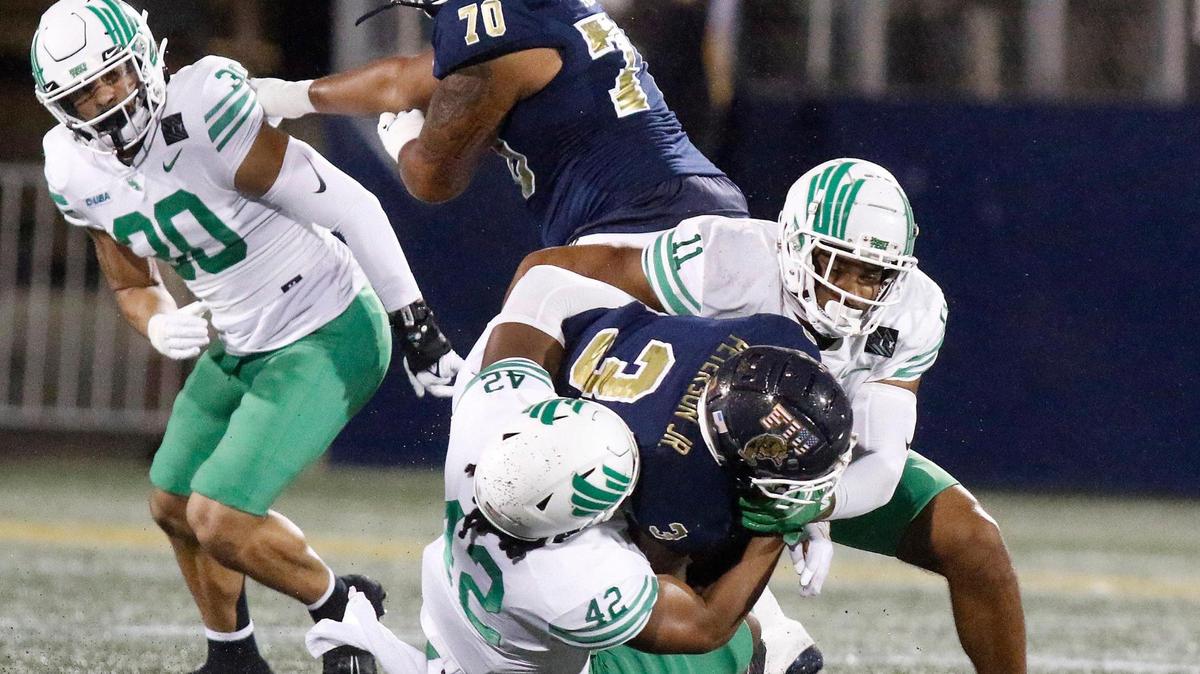 FIU Panthers running back Shaun Peterson Jr. (3) is taken down by University of North Texas during the football game on Saturday, November 20, 2021 at Riccardo Silva Stadium in Miami. Andrew Uloza / for THE MIAMI HERALD