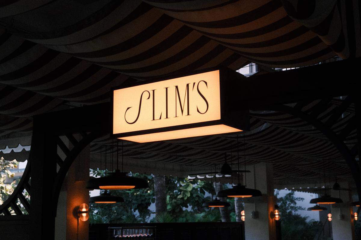 The sign for Slim’s, a new steakhouse in Bal Harbour Shops.