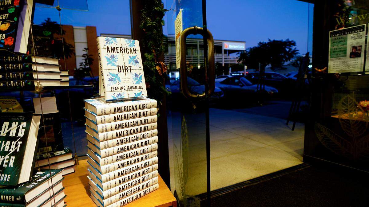 A stack of the novel “American Dirt,” by Jeanine Cummins, at Warwick’s in San Diego, Jan. 22, 2020. Cummins novel about migrants fleeing violence is a hit with booksellers, but critics have called it trauma porn that exploits another country's pain. (Sandy Huffaker/The New York Times)