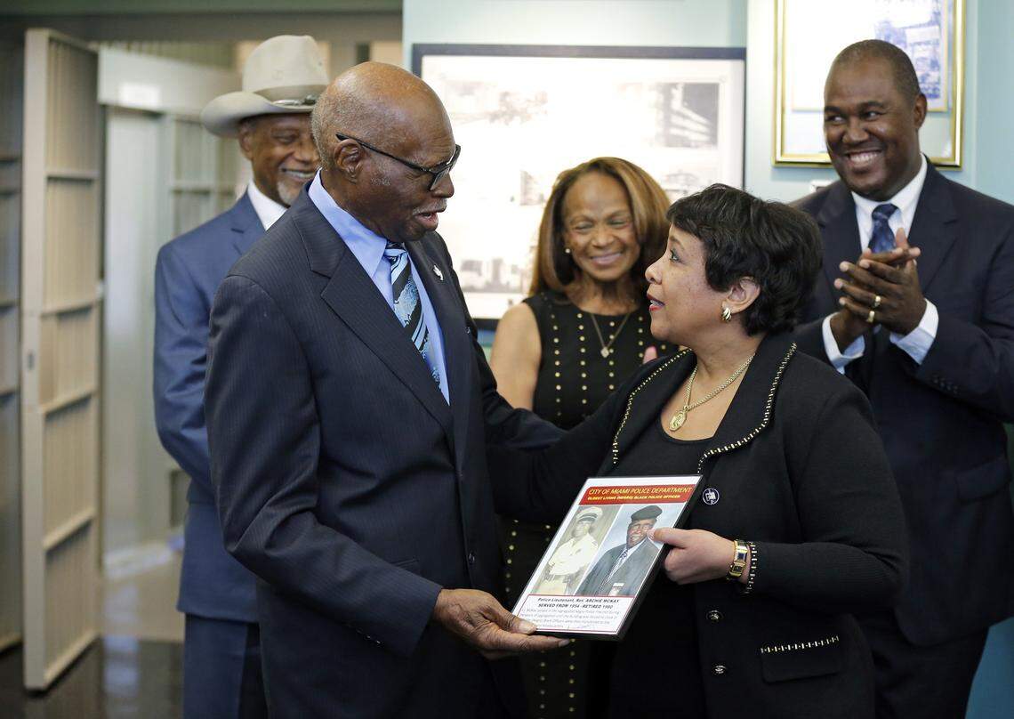 FILE - Former U.S. Attorney General Loretta Lynch is given an award at the Black Police Precinct and Courthouse Museum in Overtown on Friday, Feb. 12, 2016. Presenting is retired Miami Police Lt. Archie McKay and left to right is retired City of Miami Police Chief Clarence Dickson, Gwendolyn Dickson and retired Miami-Dade Police Chief J.D. Patterson.