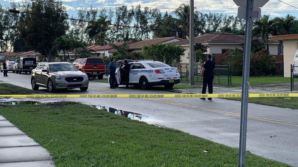 Miami police around the scene of Monday’s fatal fire.