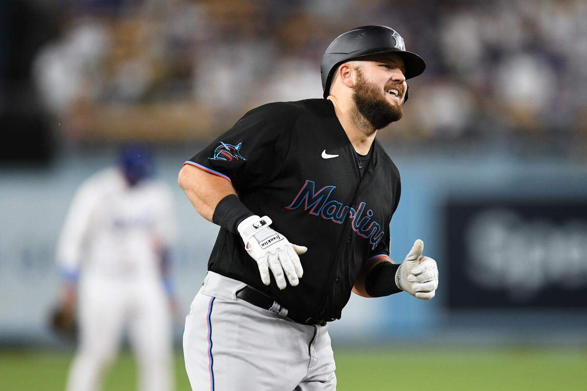 Aug 18, 2023; Los Angeles, California, USA; Miami Marlins third baseman Jake Burger (36) hits a three-run home run against the Los Angeles Dodgers during the third inning at Dodger Stadium.