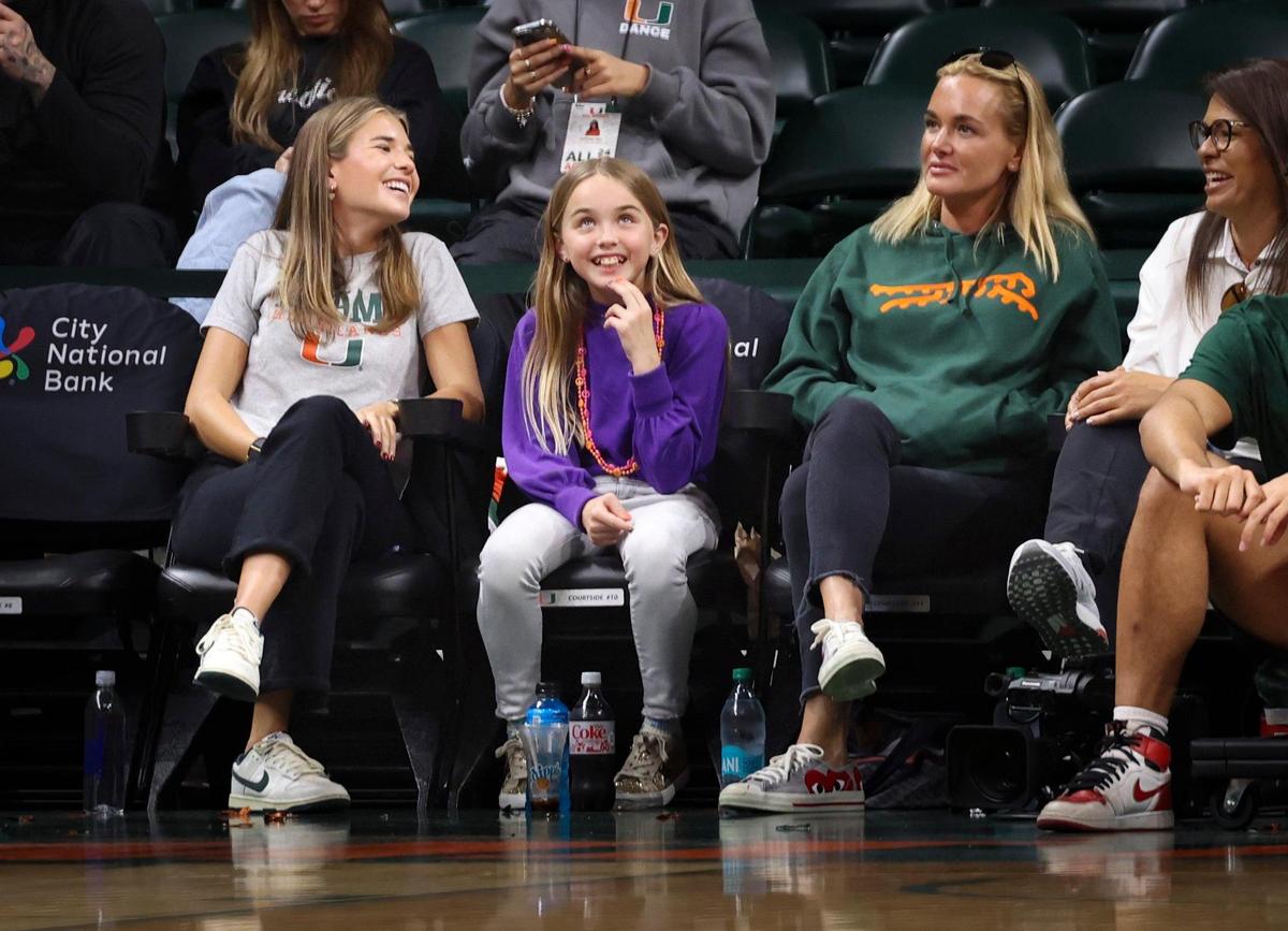 Kai Trump, granddaughter of President Donald Trump and incoming UM golfer (high school Class of ’26), left, attends the women’s basketball game with her family on Sunday, Jan. 26, 2025, at Watsco Center in Coral Gables, Fla.