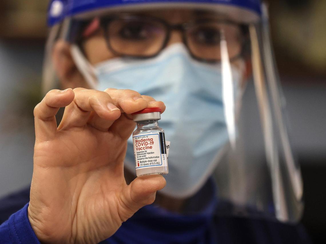 On Monday, Dec. 28, 2020, Miami Jewish Home nurse Cynthia Banada holds a multi-dose vial of the Moderna vaccine, authorized by the FDA for emergency use for the prevention of COVID-19. Each vial holds about five doses.