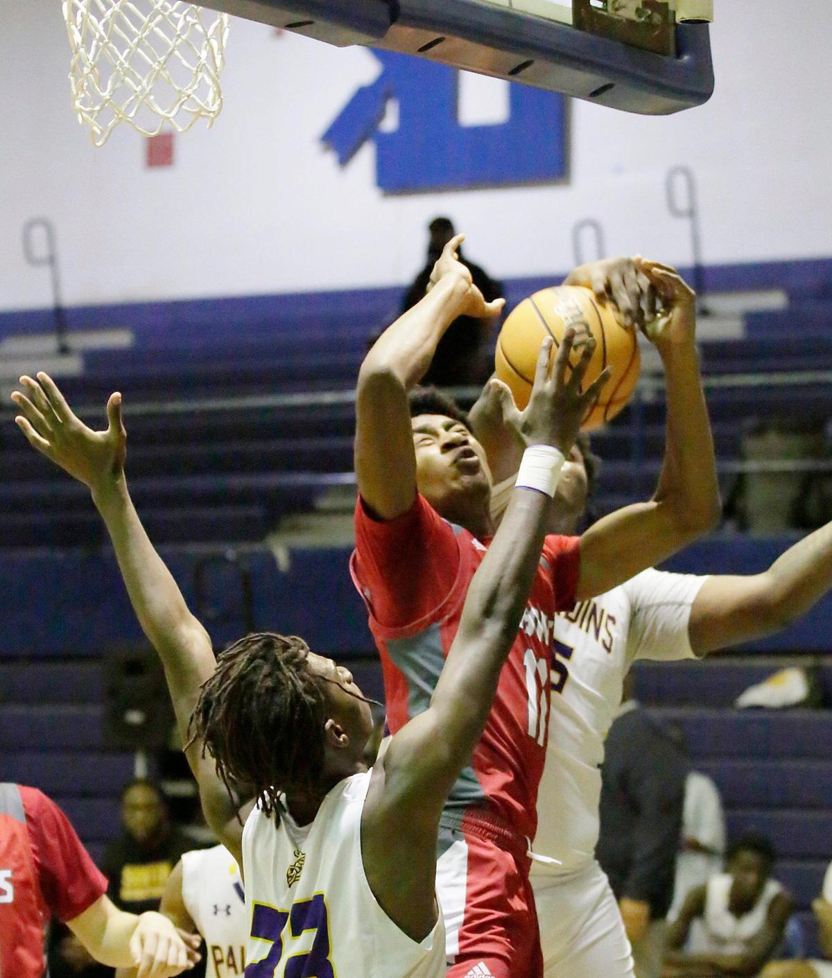 Cardinal Gibbons Chiefs Caleb Alcineus (11) tries to shoot against South Plantation Paladins during the BCAA Boys Big 8 2023 Basketball championship game on Saturday, February 4, 2023 at Fort Lauderdale HS in Fort Lauderdale. Andrew Uloza / for Miami Herald