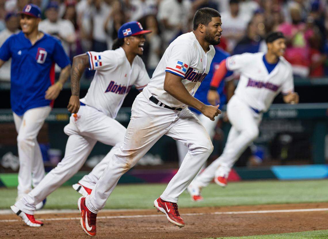 Dominican Republic first baseman Jeimer Candelario (7) celebrates after winning against Israel during the seventh inning of a Pool D game at the World Baseball Classic at loanDepot Park on Tuesday, March 14, 2023, in Miami, Fla.