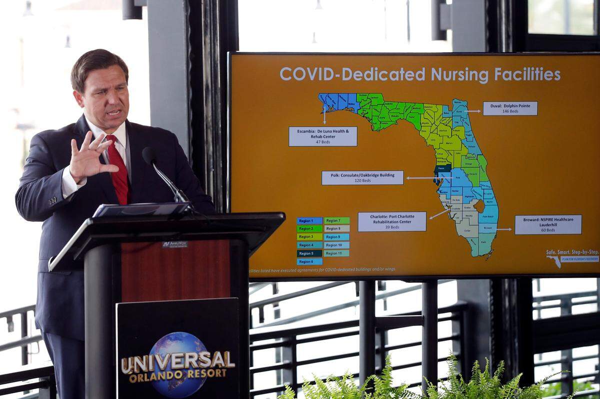 Florida Gov. Ron DeSantis speaks at a news conference at Universal Studios Wednesday, June 3, 2020, in Orlando. The Universal Studios theme park reopened for season pass holders and will open to the general public on Friday. Bars and theme parks will be part of Florida’s Phase 2 reopening after closure due to the coronavirus pandemic.