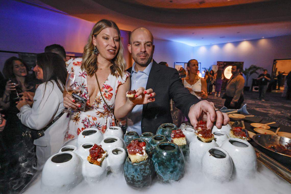 Cindy Zieba and John Rossi select a taste of Casa Zeru’s Truffle Tuna Tartare and Smoked Cream Cheese served up over a bed of dry ice as the Fontainebleau Miami Beach presents Wine Spectator's Best of the Best with 60 of the nation’s most acclaimed chefs and more than 65 of the world’s premier wineries at the resort hotel on Friday, February 20, 2026.