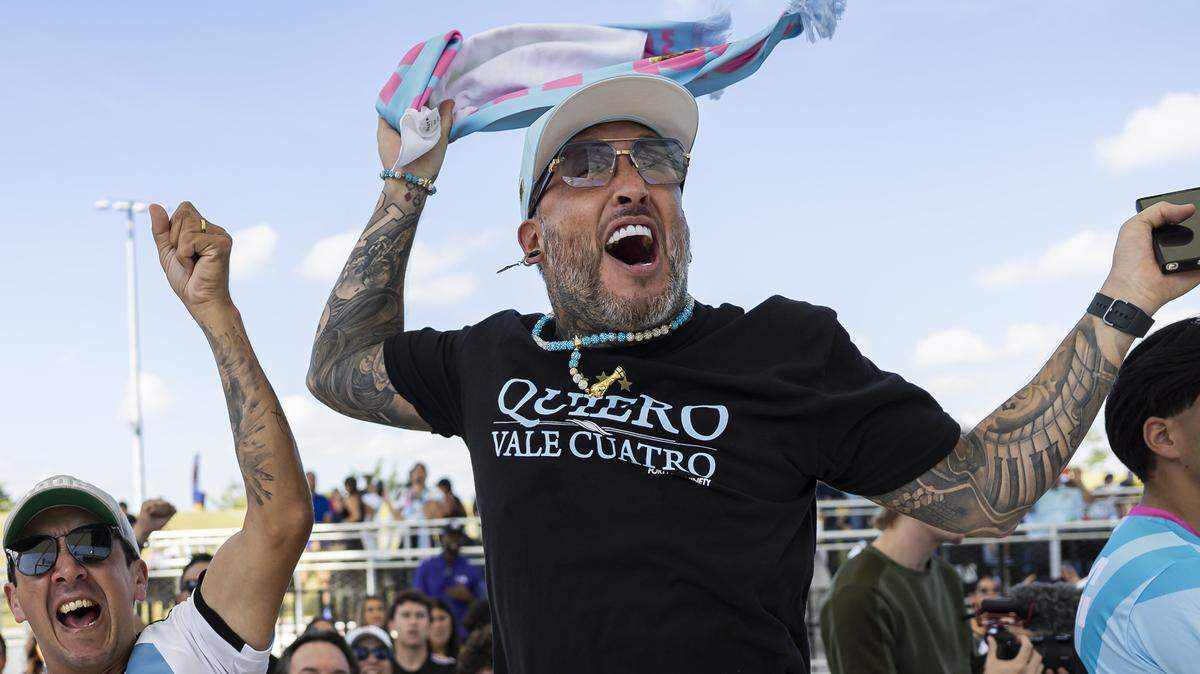 Argentine fans Jose Larrosa, left, and Facha Martinez react as they attend the FIFA World Cup 2026 Final Draw watch party at the Doral Amphitheater on Friday, Dec. 5, 2025, in Doral, Fla.