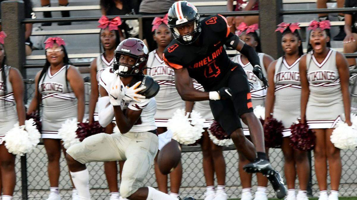 Norland wideout Terrence Honeywood has a reception broken up by Lakeland defensive back Derjah Hardy on Friday in Lakeland.