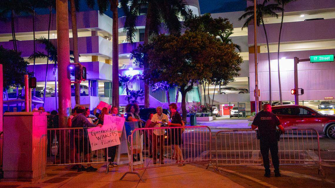 Pro-Palestinian protesters at the Aspen Ideas climate conference moved to the sidewalk across from a parking garage on 17th Street after being told by Miami Beach police that they couldn’t stand directly outside the Miami Beach Convention Center on Monday, March 11, 2024.