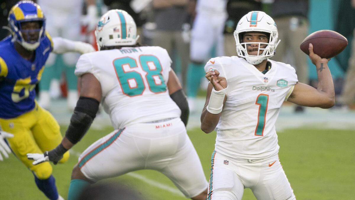 Dolphins quarterback Tua Tagovailoa passes against the Rams, with right tackle Rob Hunt offering protection. They were two of the key pieces of the 2020 Dolphins draft class.
