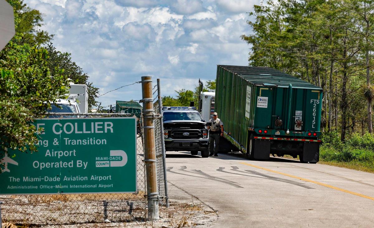 Trucks arrive at the entrance of Alligator Alcatraz. The detention facility is under construction, located at the Dade-Collier Training and Transition Airport, formerly the Everglades Jetport, on Wednesday, June 25, 2025. The facility is within the Florida Everglades, 36 miles west of the central business district of Miami, in Collier County, Florida.