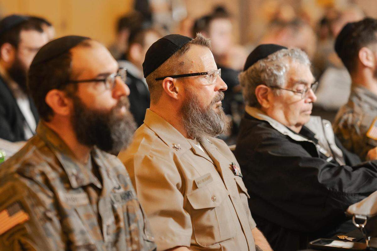 Jewish military chaplains and service members listen in on a panel during a training conference that focuses on helping Jews serving in the military maintain their religious identity and observance while on duty.