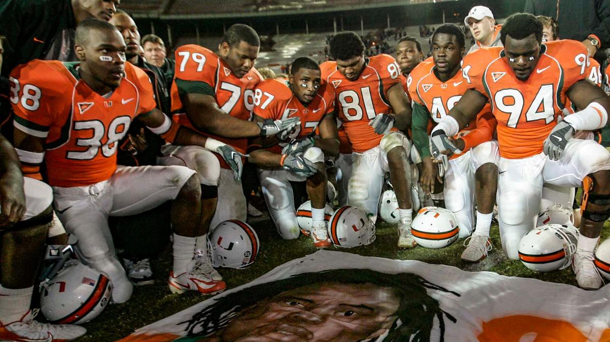 UM players pay their respects to Bryan Pata at end of a game against Boston College on November 23, 2006. Rashaun Jones (#38) is at the far left.