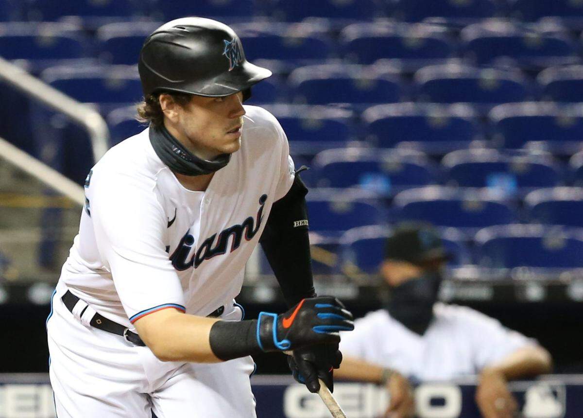 Miami Marlins third baseman Brian Anderson (15) looks towards the infield after hitting the ball as the Miami Marlins host the New York Mets at Marlins Park in Miami on Wednesday, August 19, 2020.