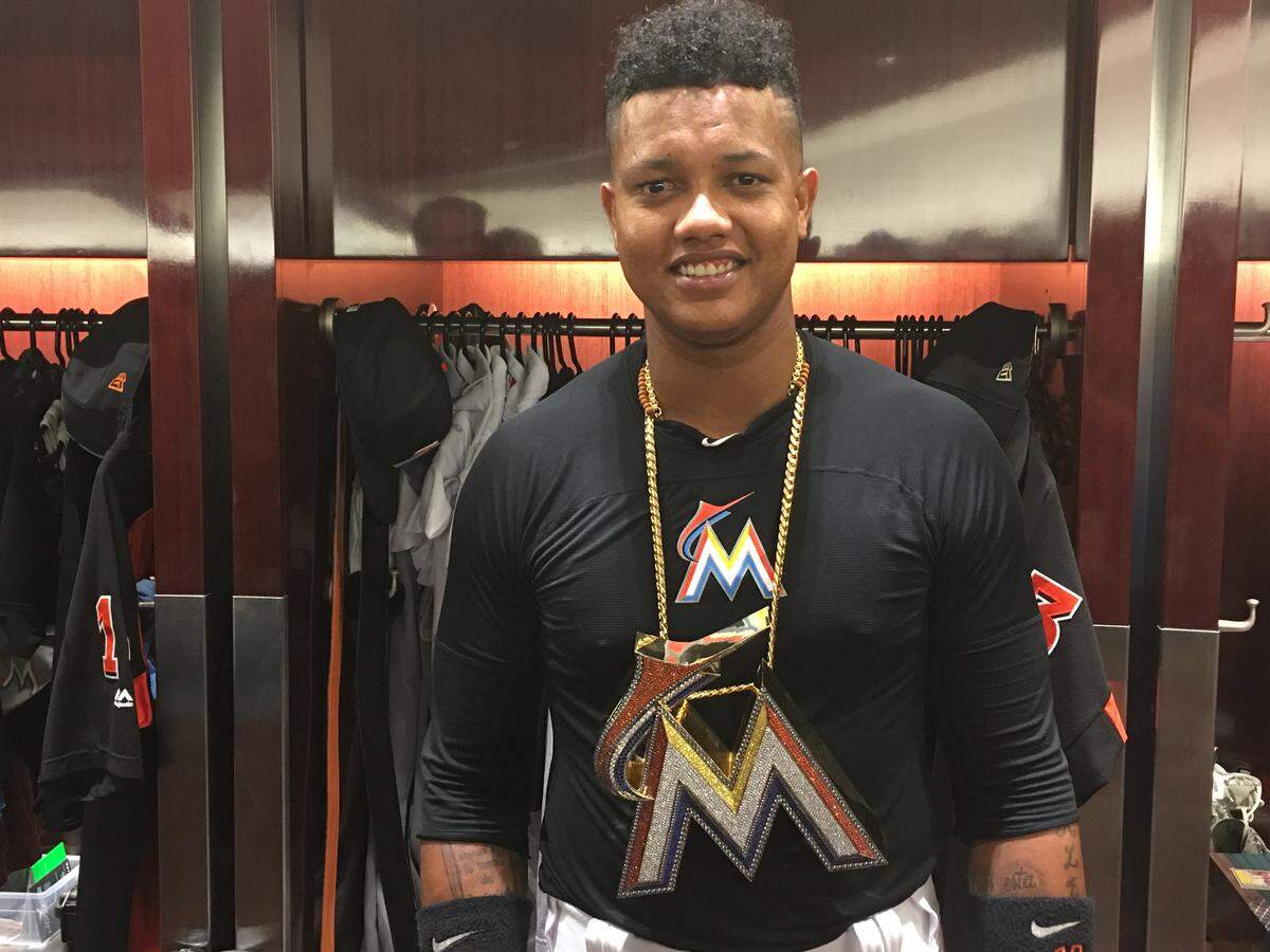 The Marlins’ Starlin Castro was awarded the team’s MVP chain after hitting a three-run homer in the fifth inning of Tuesday’s win against the Braves.
